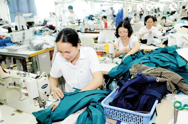 Workers at Nha Be Garment Company in HCMC (Photo: SGGP)